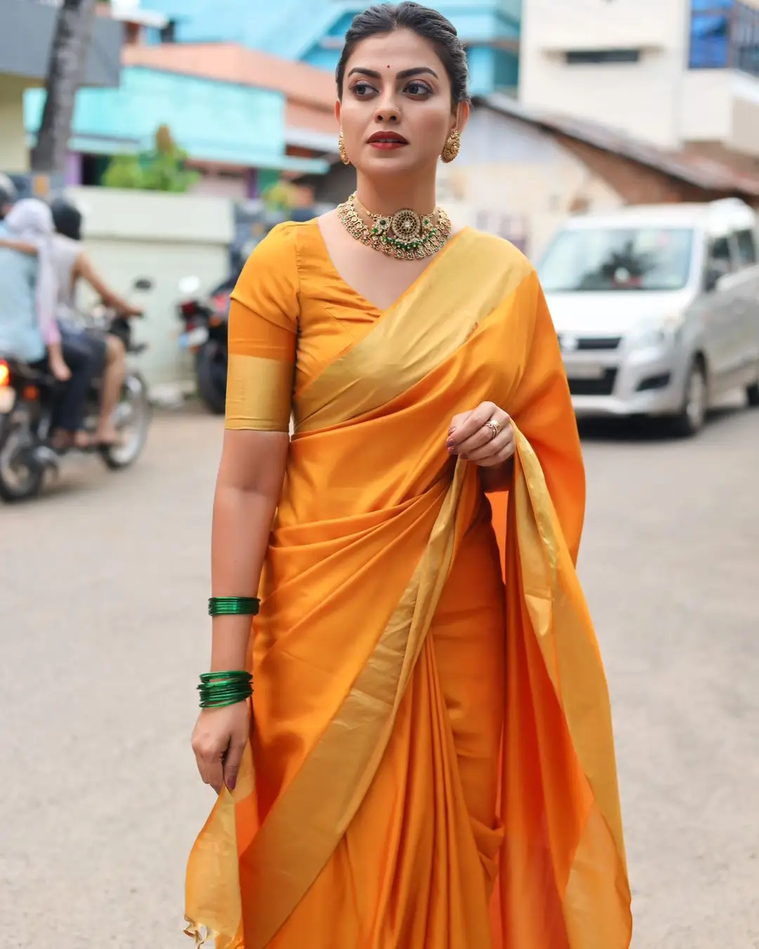 Anusree Nair Wearing Beautiful Earrings Jewellery Orange Saree Blouse